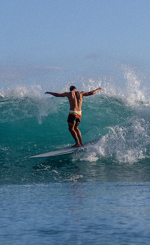Kevin Skvarna wearing the 300 boardshorts in Horizon Tobacco while surfing.