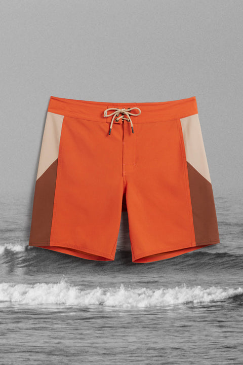 Paprika and Tan Birdie Boardshorts with black and white ocean background.