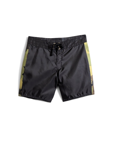 Flatlay of GoRuck 300 Boardshorts. Black Boardshort with left and right vertical stripes in camo.