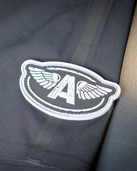 Close up shot of the 3D rubberized Archy's Garage Logo on the pant leg.