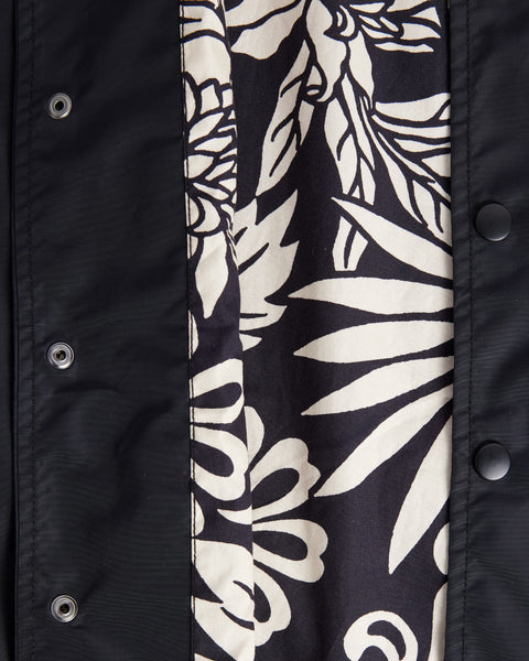 Interior view of the black and white botanical pattern on the interior of the jacket.