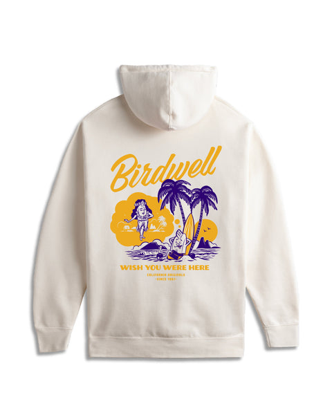 Flatlay of back of the bone hoodie. Graphic in yellow and purple of daydreaming birdie leaning against a surfboard under two palm trees dreaming of hula birdie.