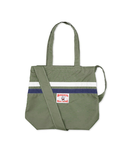 Front View of Army Green Nylon Tote with two horizontal stripes in white and navy. Featuring one hand strap and one shoulder strap. Birdwell license plate label below navy strap in center of the bag.