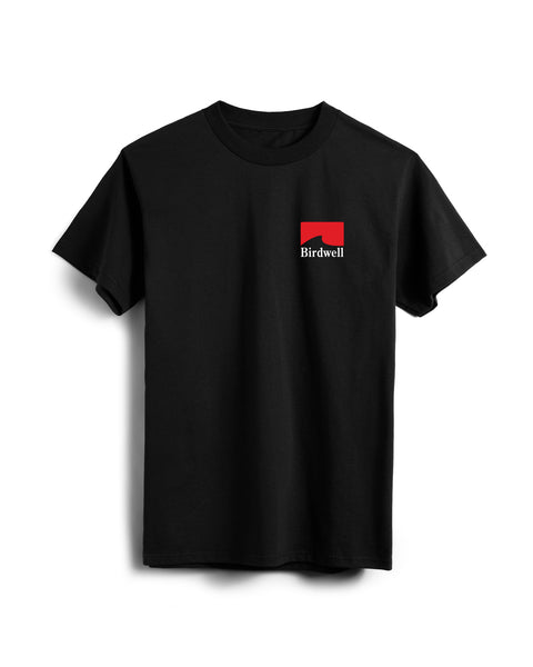 Front View of black T-Shirt with Grit Graphic of red wave with white Birdwell text. Background White.