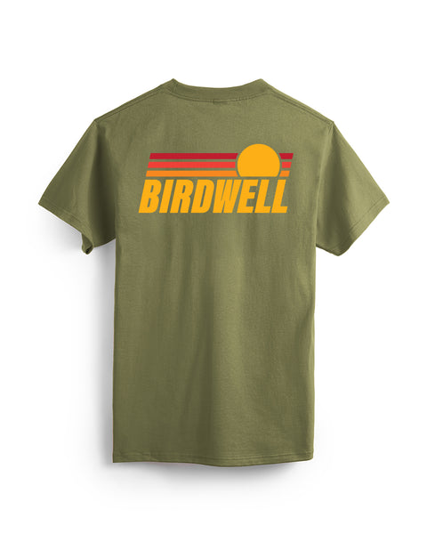 Back of Navy T-Shirt with large graphic over top back of shirt with Yellow Birdwell Text and three horizontal bars one red, orange and yellow and half circle to look like a sunset. Product on white background.