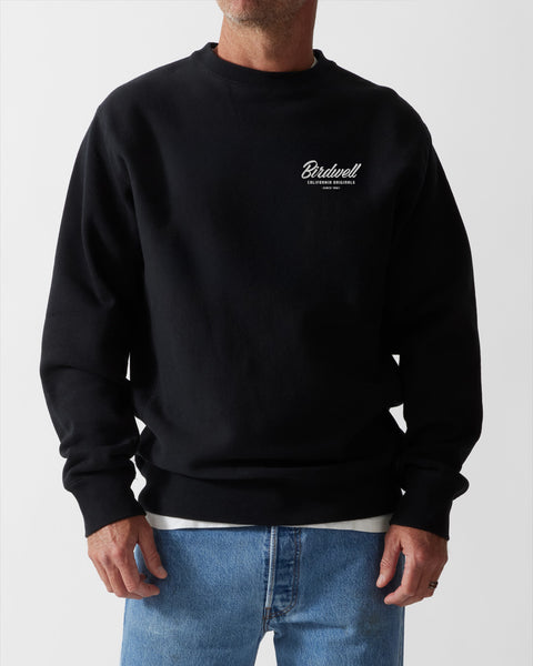 Front of black crew neck sweatshirt with Screenprint of 