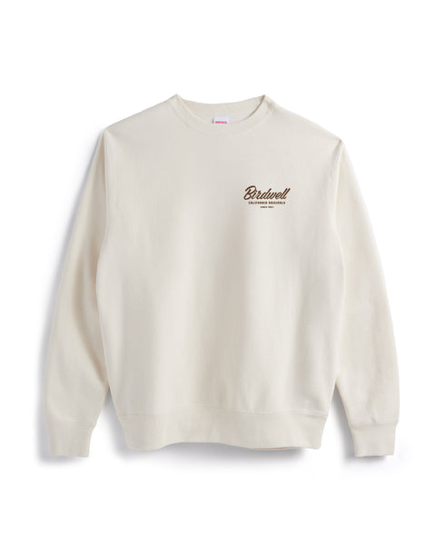 Bone colored sweatshirt on white background. Screenprint on left chest area with 