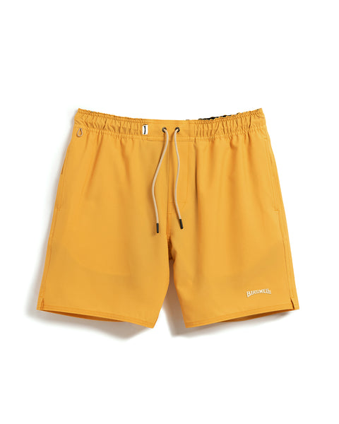 Front View of Wright Lined Short in Gold with Tan Drawstrings and key loop. Elastic waist with birdwell logo label in white and birdwell logo on bottom right leg. Product on white background.